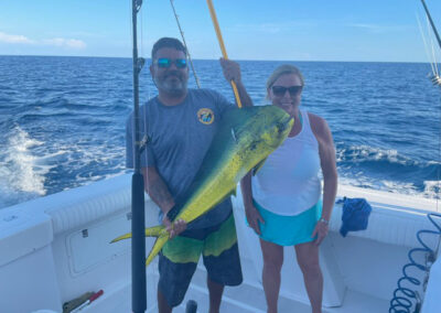 Fisherman hold ups his big catch on the La Patrona charter fishing boat in Mazatlan Mexico