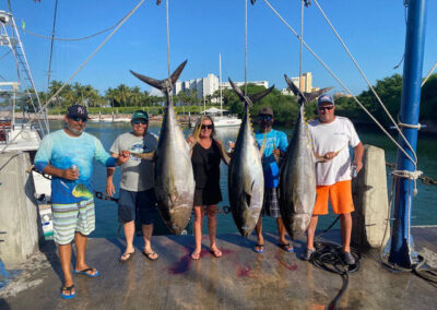 La Patrona guides with charter fishing participants and the fish they caught