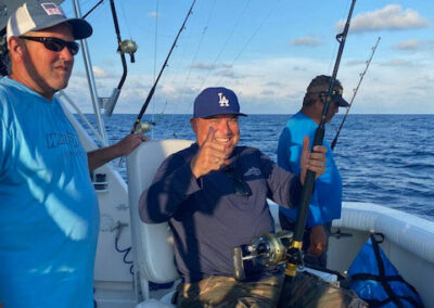 Men happily fishing on the La Patrona charter fishing boat in Mazatlan