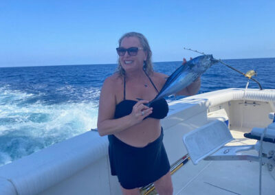 Rhonda Ziegler Owner of La Patrona Holding a Bait Fish