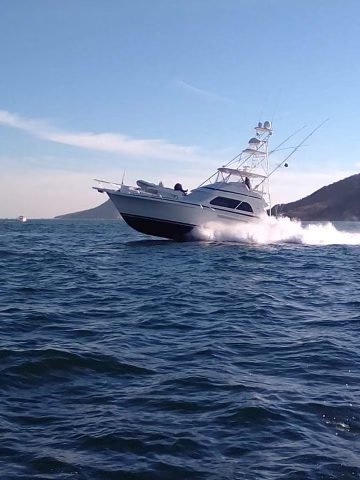 The La Patrona charter fishing boat in Mazatlan Mexico speeding by