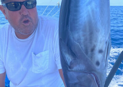 Ziegler holds a large bait fish on the La Patrona charter fishing boat in Mazatlan Mexico